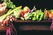 Cosa mangiano i vegani? Laden Table with Fruits and Vegetables